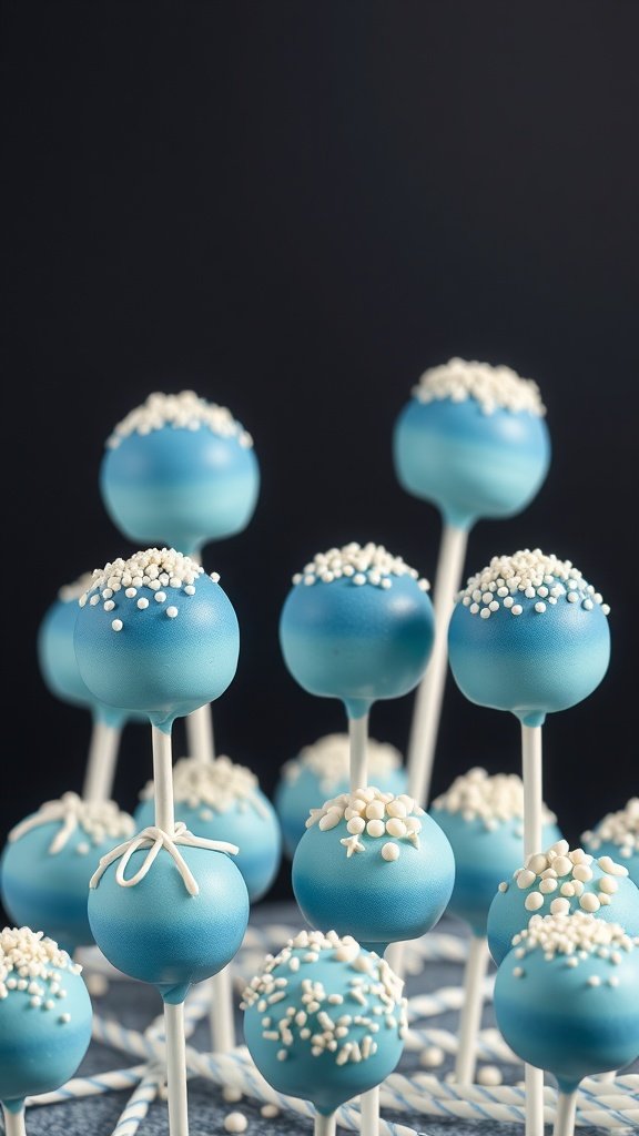 A display of blue ombre cake pops with white sprinkles on top