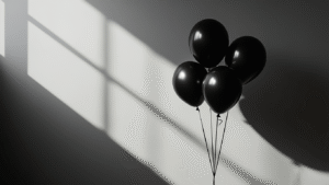Cinematic close-up of elegant black balloons against a minimalist background, featuring dramatic lighting and subtle burgundy accents, with textures and contrasts creating an atmospheric, sophisticated vibe.