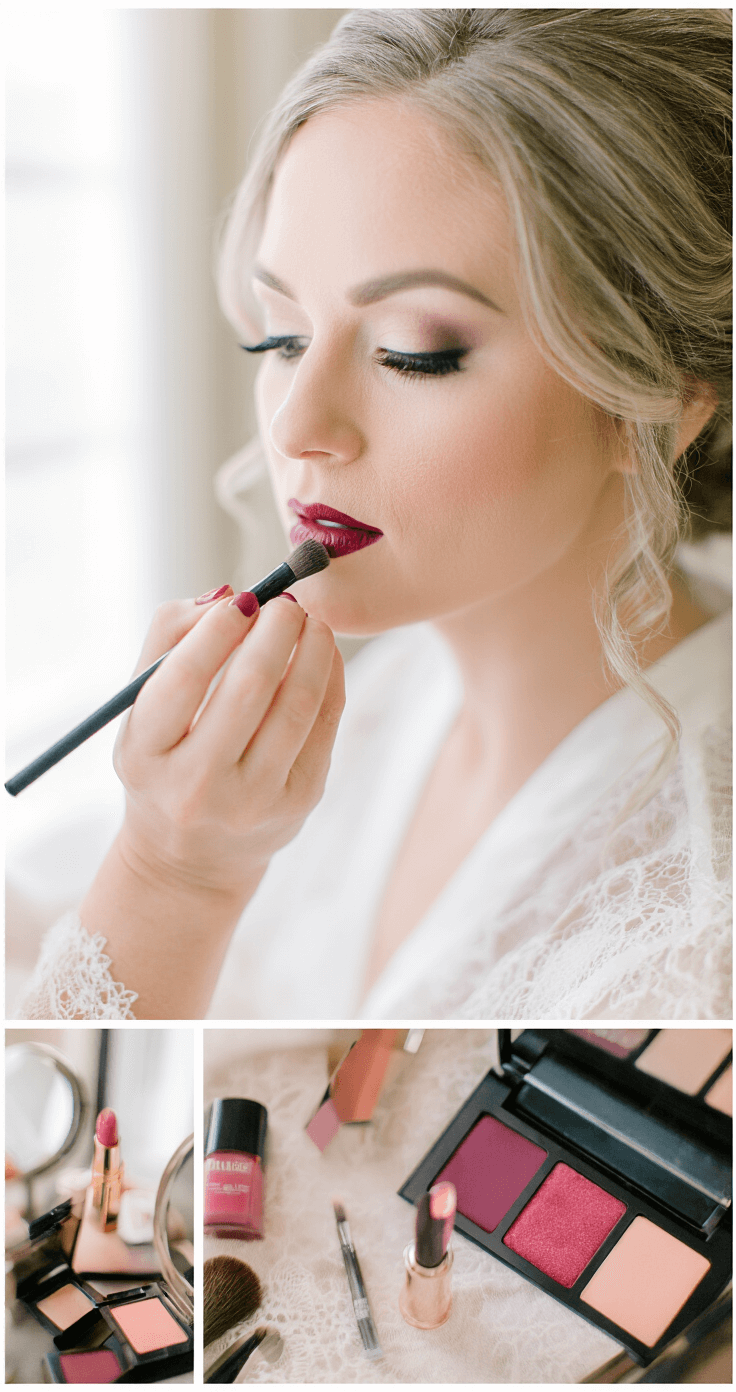 Close-up of a bride applying lipstick in a luxurious dressing room, showcasing perfectly lined lips, professional brushes, and lip products, with soft natural light illuminating her delicate lace getting-ready robe and highlighting her makeup precision in deep berry, nude, and soft pink tones.