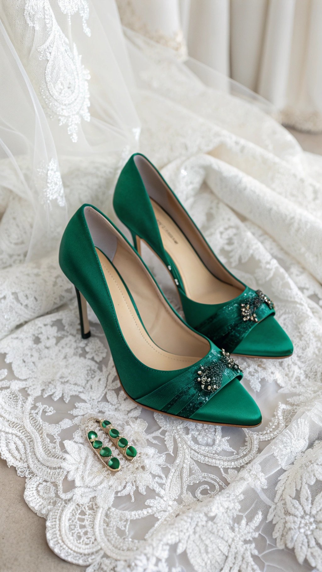 Emerald green bridal shoes with embellishments on lace fabric